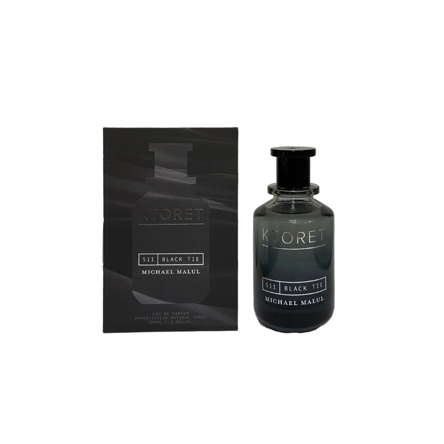 Michael Malul KTORET Black Tie 511 Eau de Parfum: una botella de fragancia de vidrio oscuro junto a su caja negra, con una presentación elegante y sofisticada.