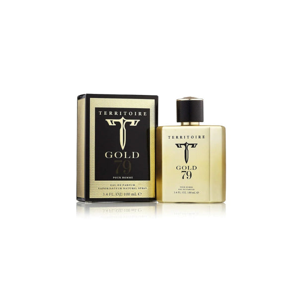 Botella de perfume metálica dorada mate "Territoire Gold 79 Pour Homme" de 100 ml con el logotipo de la 'T' estilizada y tapón negro con detalles dorados, junto a su caja negra con bordes dorados texturizados y detalles en dorado y blanco.