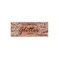 Caja de paleta de sombras con glitter en tono rose-gold con la etiqueta "trendbeauty Glitter Palette", presentada sobre un fondo blanco; su empaque lleno de brillo se siente glamoroso y festivo.