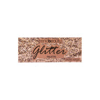 Caja de paleta de sombras con glitter en tono rose-gold con la etiqueta "trendbeauty Glitter Palette", presentada sobre un fondo blanco; su empaque lleno de brillo se siente glamoroso y festivo.