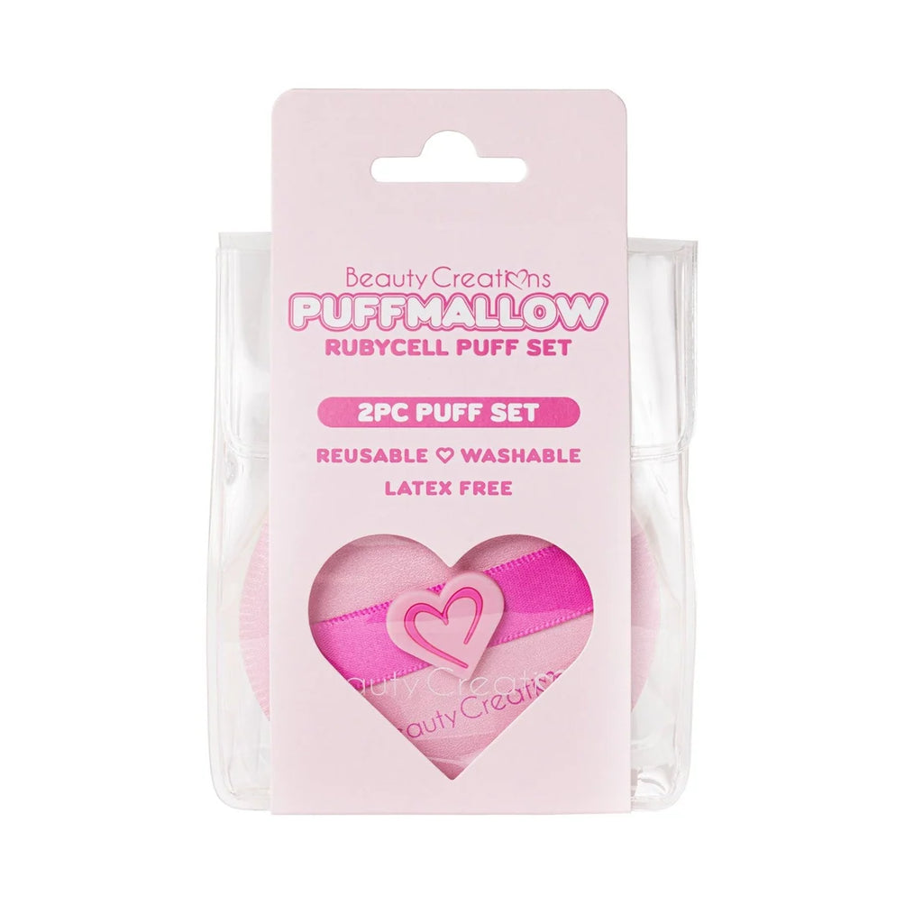 Set de esponjas "Puffmallow" Rubycell en rosa, presentado en un empaque transparente con dos esponjas de maquillaje reutilizables con forma de corazón; diseño de producto de belleza suave.